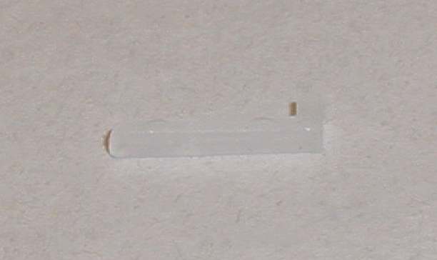 Scalextric car body to chassis fixing clip